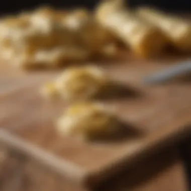 Crafted Perfection: Artisanal Pasta Dough Artisanal pasta dough resting on wooden board