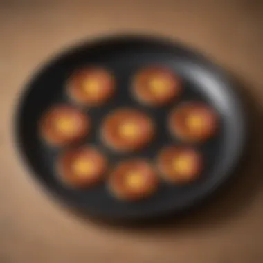 A diagram illustrating heat distribution patterns in black pizza pans during cooking.