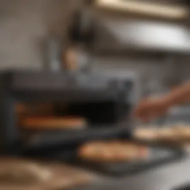 User engaging with the Camp Chef Griddle Pizza Oven