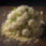 Cauliflower florets being transformed into a fine rice-like texture