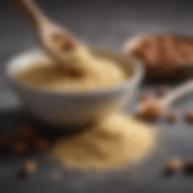Almond Flour Texture A bowl of almond flour with a wooden spoon resting beside it, showcasing its fine texture.