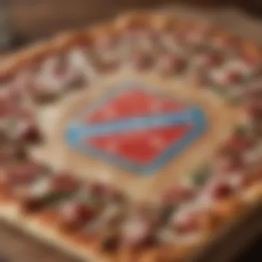 A Domino's pizza box showcasing the brand's iconic logo