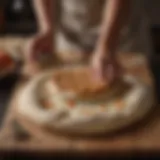 Artisan flatbread dough resting on a wooden board