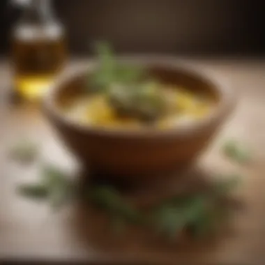 A bowl of olive oil with herbs