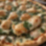 A close-up view of a freshly baked Chicken Florentine pizza topped with spinach and cheese