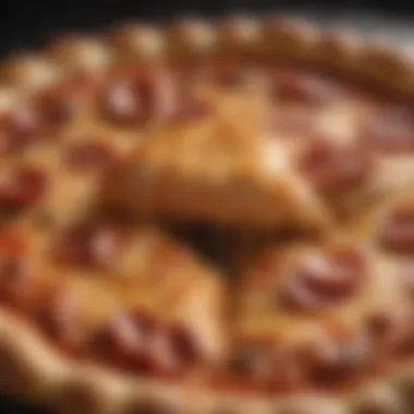 A close-up of a filled crust pizza revealing its gooey, cheesy interior.