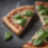 Delicate basil leaves on a thin pizza slice