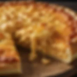 A close-up of a slice of Mac and Cheese Pizza showcasing its creamy texture and cheese blend