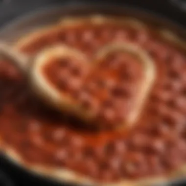 A simmering pot filled with rich, aromatic pizza sauce on the stove.