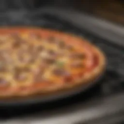Close-up of a stove top oven pan with a golden-brown pizza