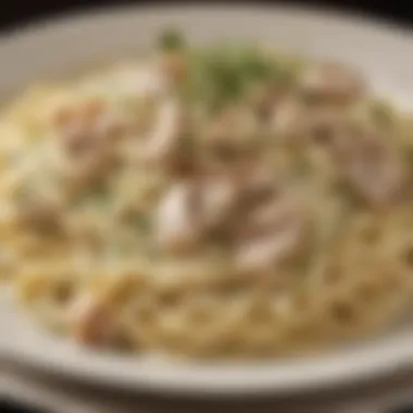 Creamy fettuccine alfredo topped with grilled chicken and herbs