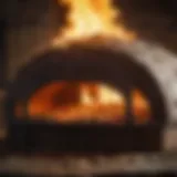 Wood-fired pizza oven emitting flames