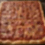 A close-up view of a traditional Sicilian pizza showcasing its thick crust and toppings.