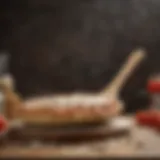 Wooden pizza peel with flour and dough