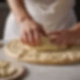 Freshly kneaded pizza dough on marble surface