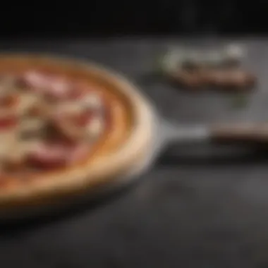 A metal pizza paddle showing its sleek design and functionality.