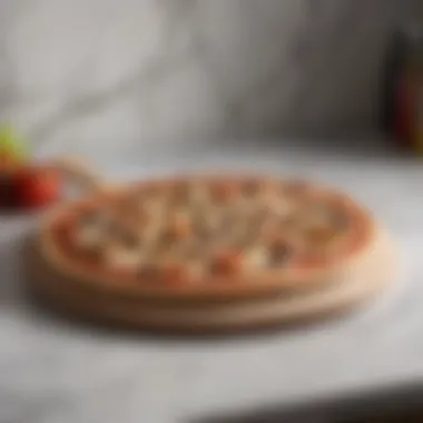 A beautifully crafted wooden pizza paddle resting on a marble countertop.